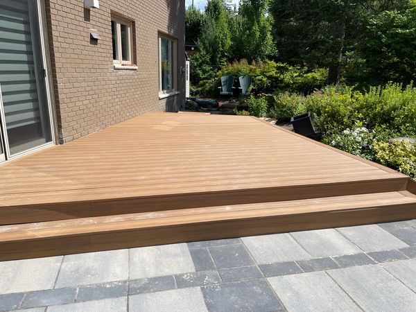 Large composite deck in warm brown tone in Kanata