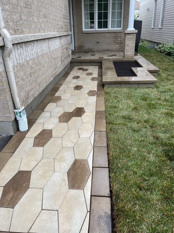 Front entrance interlock installation with custom garden using Techo-Bloc interlock