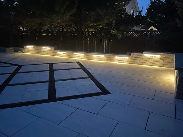 Interlock backyard installation with artificial grass, interlock and landscape lighting Stittsville