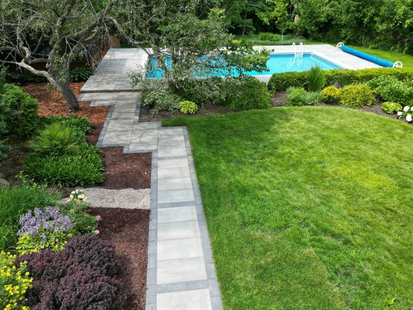 Interlock path through garden leading to pool area in Kanata