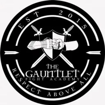 Logo of The Gauntlet Fight Academy featuring armored and bare fists.