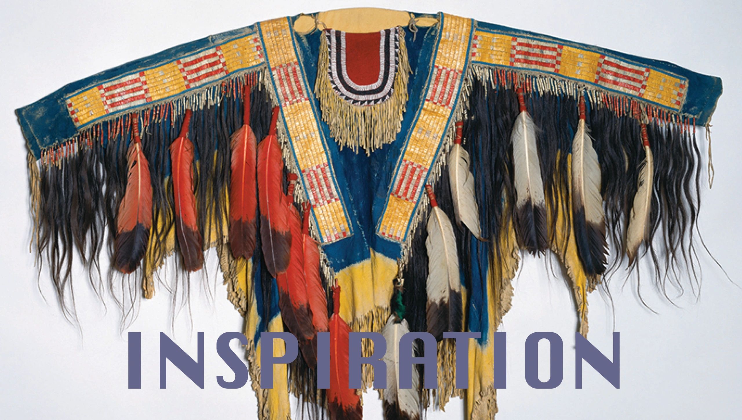 Intricately decorated Native American garment with feathers and beadwork.