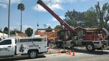 A white truck and a crane