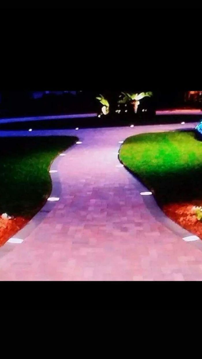 Vertical photo of paver walkway lighting