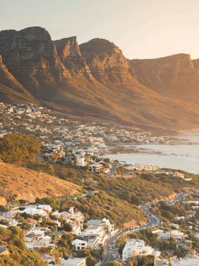 Spectacular view of mountains meeting the ocean in South Africa, perfect for a friends' adventure.