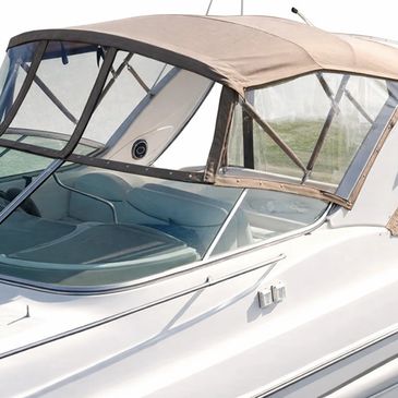 Recent upholstered beige canvas cover over the cockpit area.