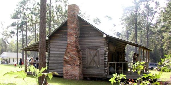 a wooden house with a chimney