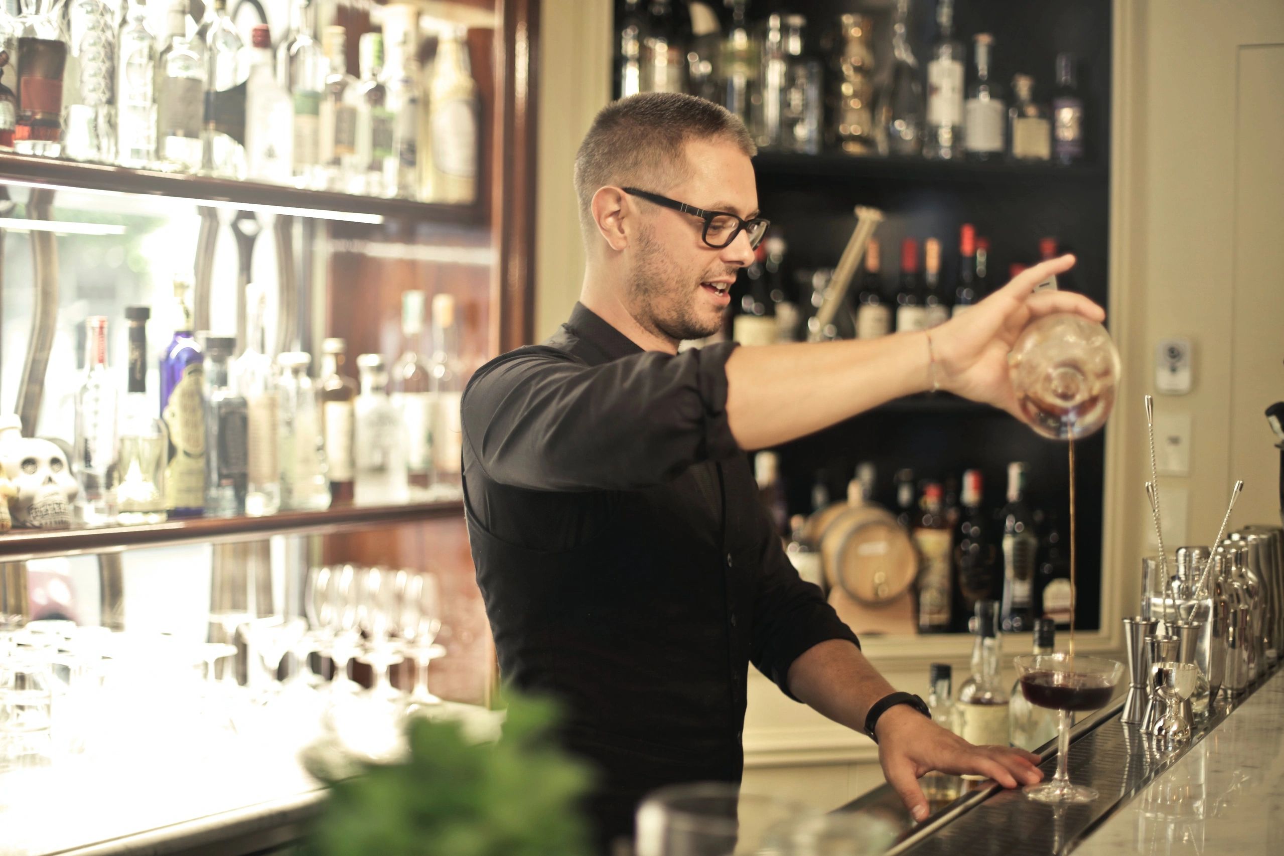 Bartender crafting a cocktail 