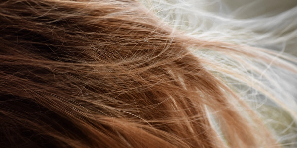Flowing hair strands - symbolizing natural movement for hair restoration and wigs.