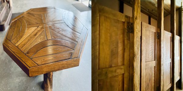 Hand made solid rustic reclaimed wood doors with a hand made table on reclaimed wood beam legs