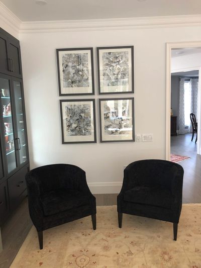 Family Room with dark stained custom cabinetry and custom funishings.  Framed art and rug from Elte.