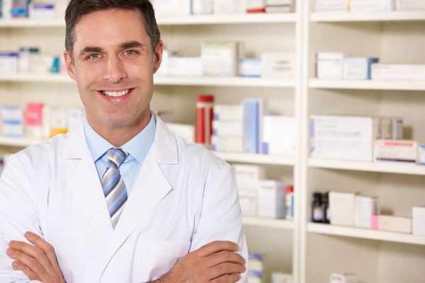 pharmacist standing with cross hands