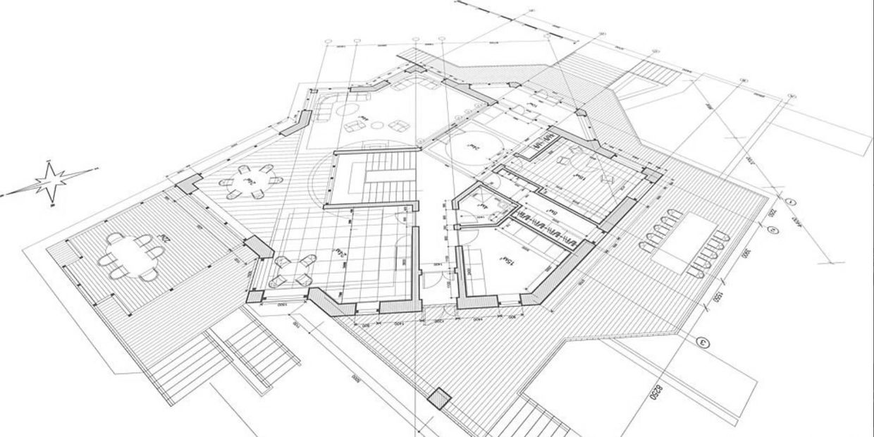Detailed architectural floor plan of a building with furniture and measurements.