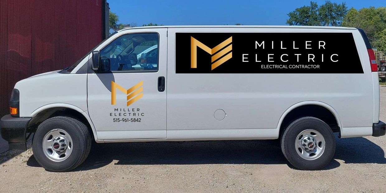 White van with the golden Miller Electric logo on the side and back
