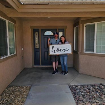 Friends and happy homeowners celebrating their new home purchase in Apple Valley with REALTOR® Adria Chamberlain.