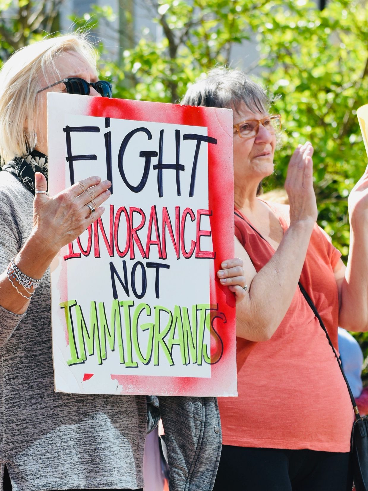 Protestors Holding Up A Sign