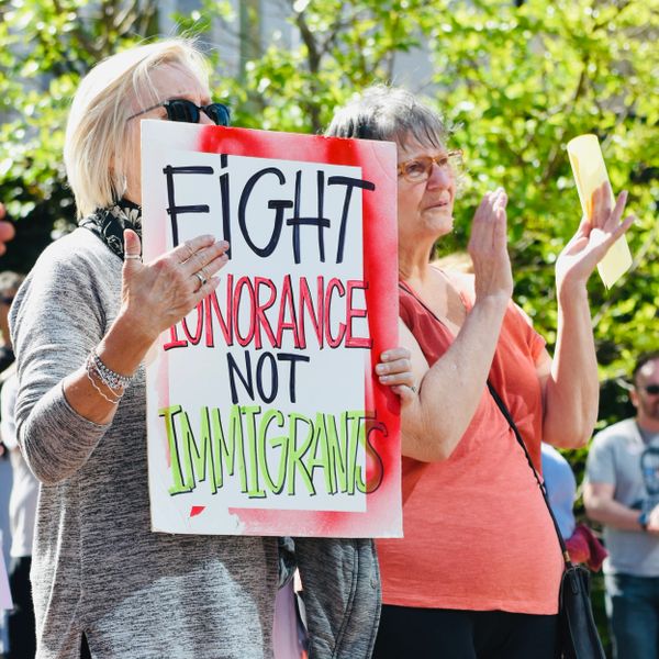 Protestors Holding Up A Sign