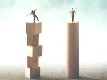Two figures balancing on different wooden structures.