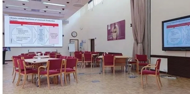 Meeting space with chairs, tables, LED video wall