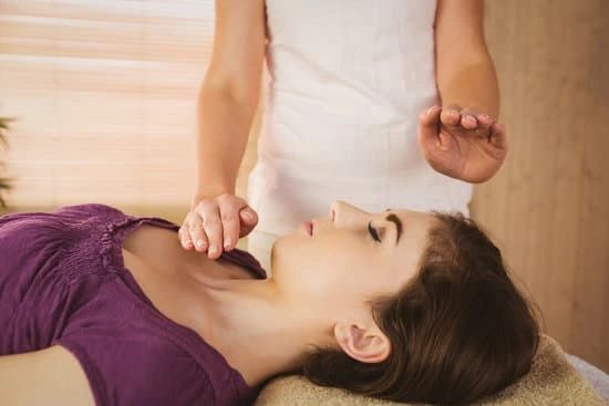 lady receiving energy healing reiki to head and chest