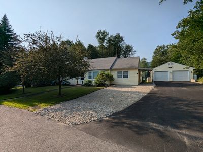 Room for 6 cars (2 rows  3 tandem each) and 1 spot on gravell to the left of driveway.