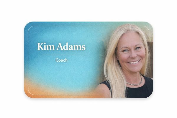 Business card featuring Kim Adams, a coach, with a blue and orange gradient background.