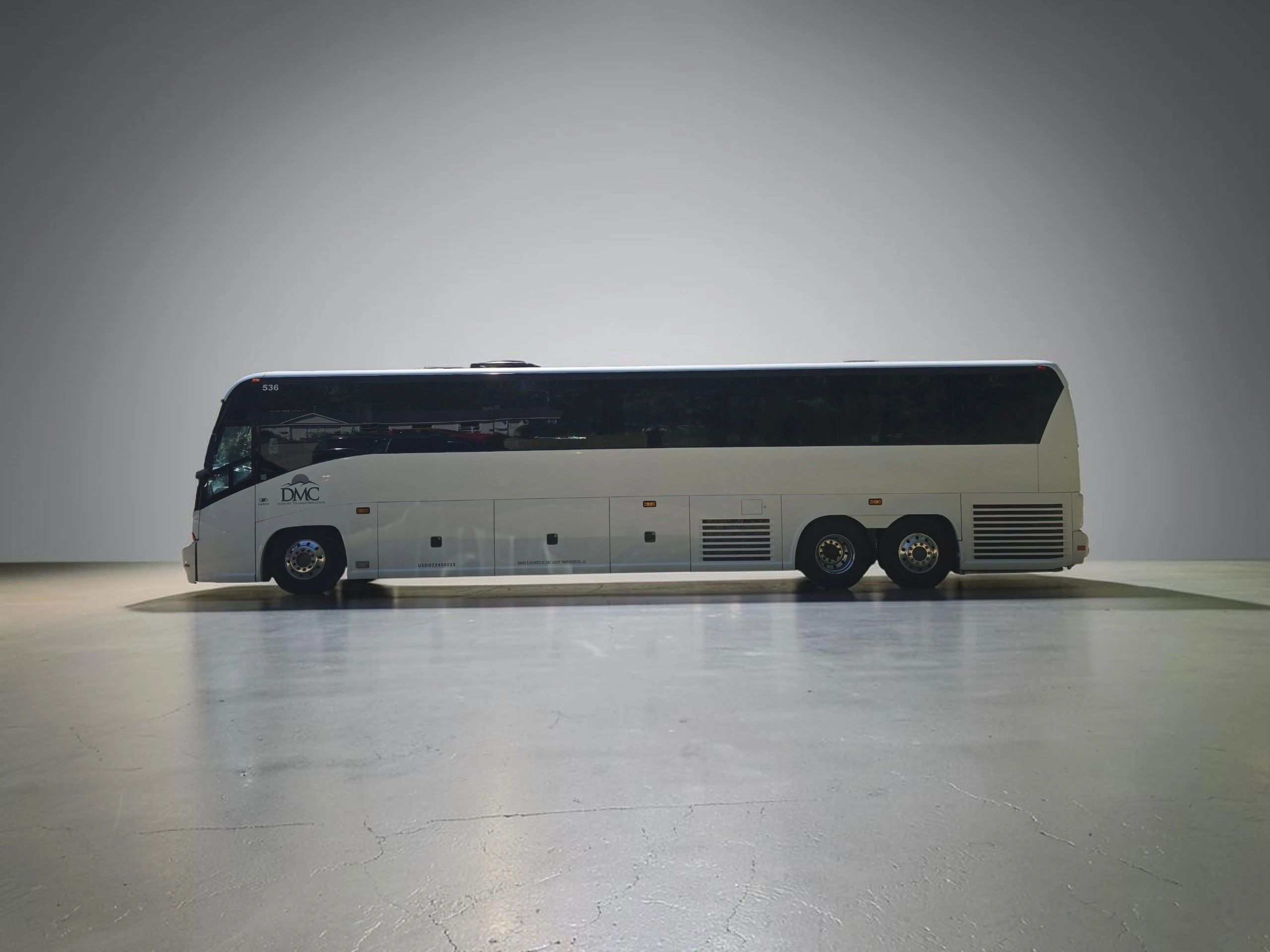 White luxury charter bus side view