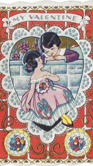 Vintage Valentine card featuring a boy and girl in a heart frame.