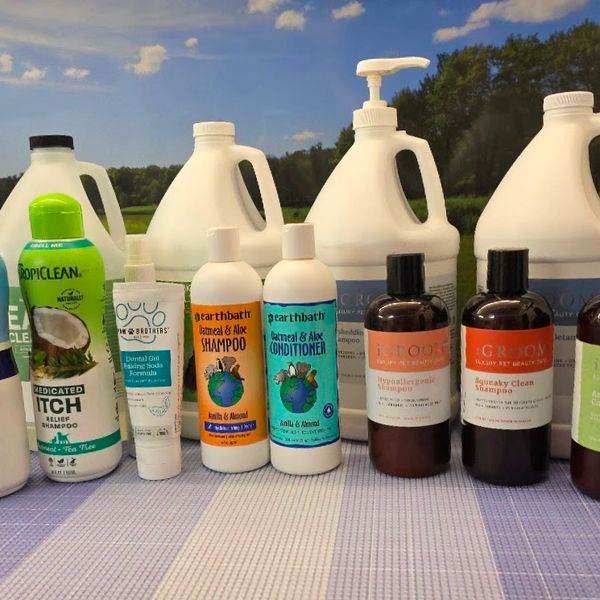 Various personal care products including shampoos and conditioners displayed outdoors.