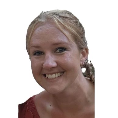 Smiling woman with blonde hair and earrings.