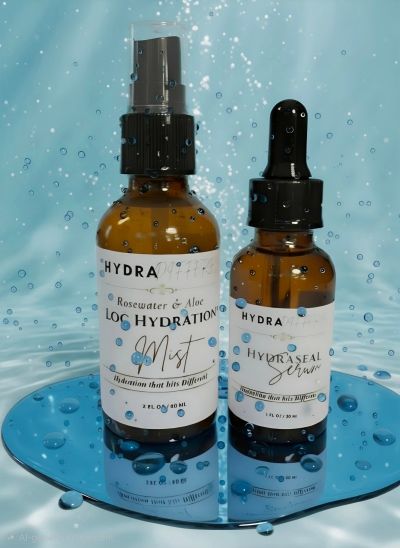 Hydra skincare mist and serum bottles on a reflective surface with water droplets.