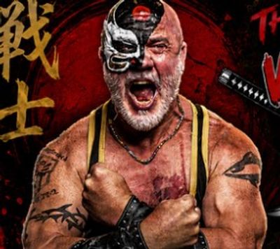 Muscular man with face paint and tattoos flexing his arms.