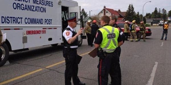 Police and emergency responders at command post.