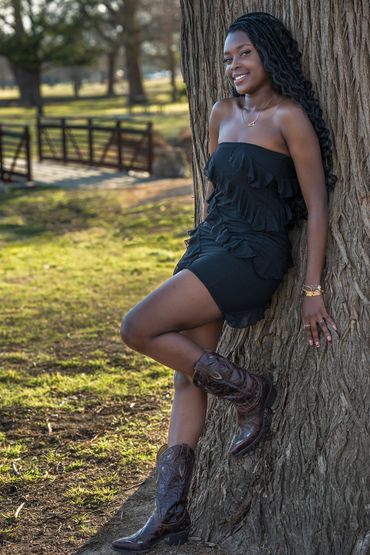 Senior-Girl-black-dress-boots-leaning- against-tree-San-Gabriel-Park-Georgetown-Texas