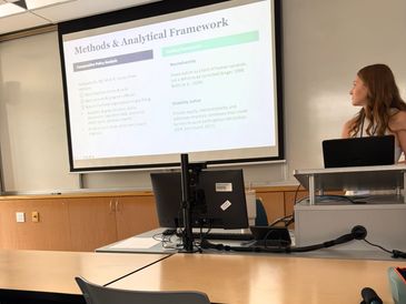 Person presenting academic slide on methods and analytical framework.