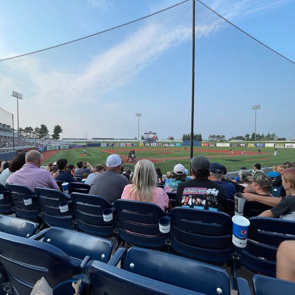 Spectators watching a baseball game at Turtle Creek Stadium