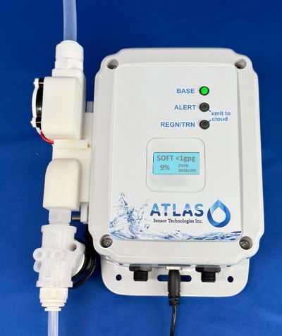 ATLAS water sensor device by Sensor Technologies Inc. with status indicators and tubing connections.
