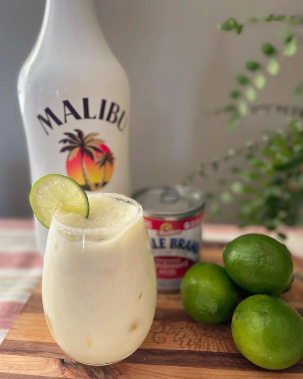 Fresh aguas frescas made with fresh limes, sweetened condensed milk, and Malibu coconut rum. 