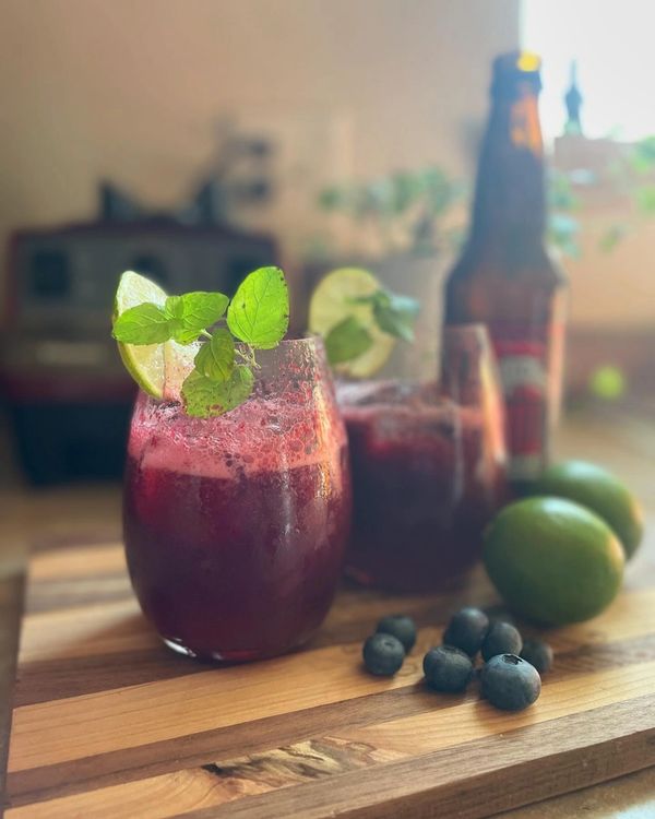 Triple berry moscow mule made with fresh fruit purée and vodka topped with ginger beer. 