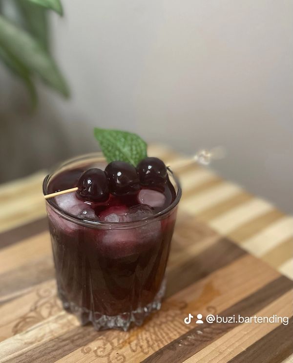 Classic Shirley Temple mocktail with Bordeaux cherries and lemon lime soda. 