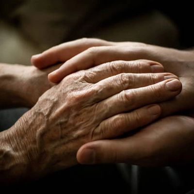 holding hands with an elderly person