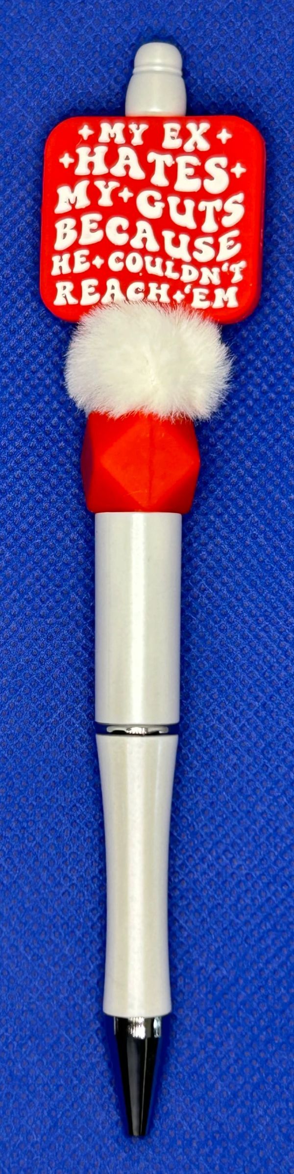 Decorative pen with a humorous phrase.
