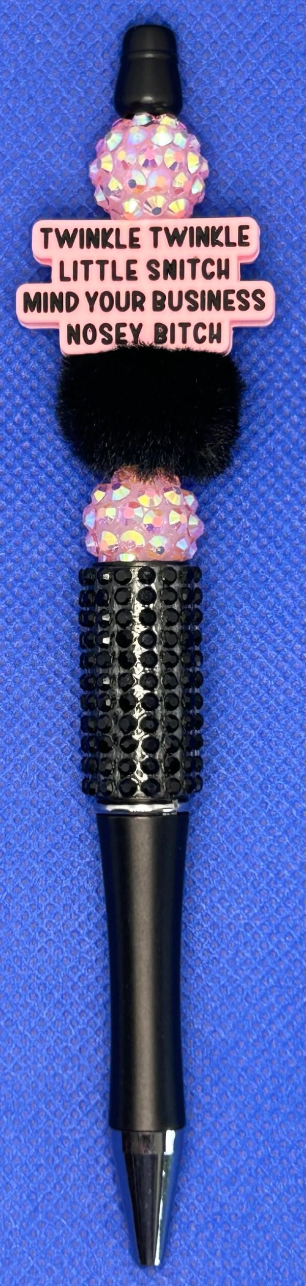 Decorative pen with a sassy message on a blue background.