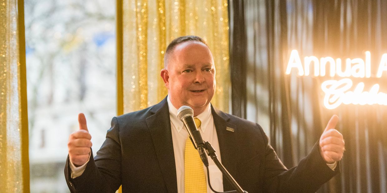 Dan Powell speaking at a Real Estate Awards Ceremony in Rochester NY