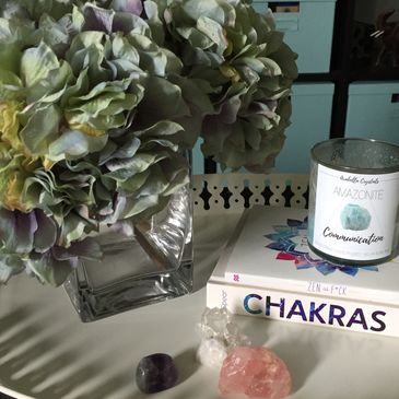 Guest tray of books, crystals, flowers, and a candle
