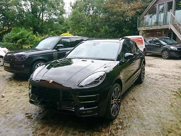 Polished cars in a backyard