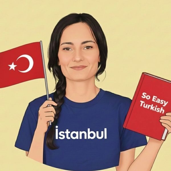 A woman holding a Turkish flag and a Turkish language book, wearing an Istanbul t-shirt.