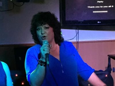 Karaoke singer giving it a go