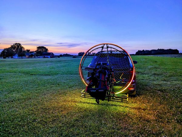 The Secret Squirrel SkyHalo PPG light kit on a paramotor frame, sitting on a car travel hitch.