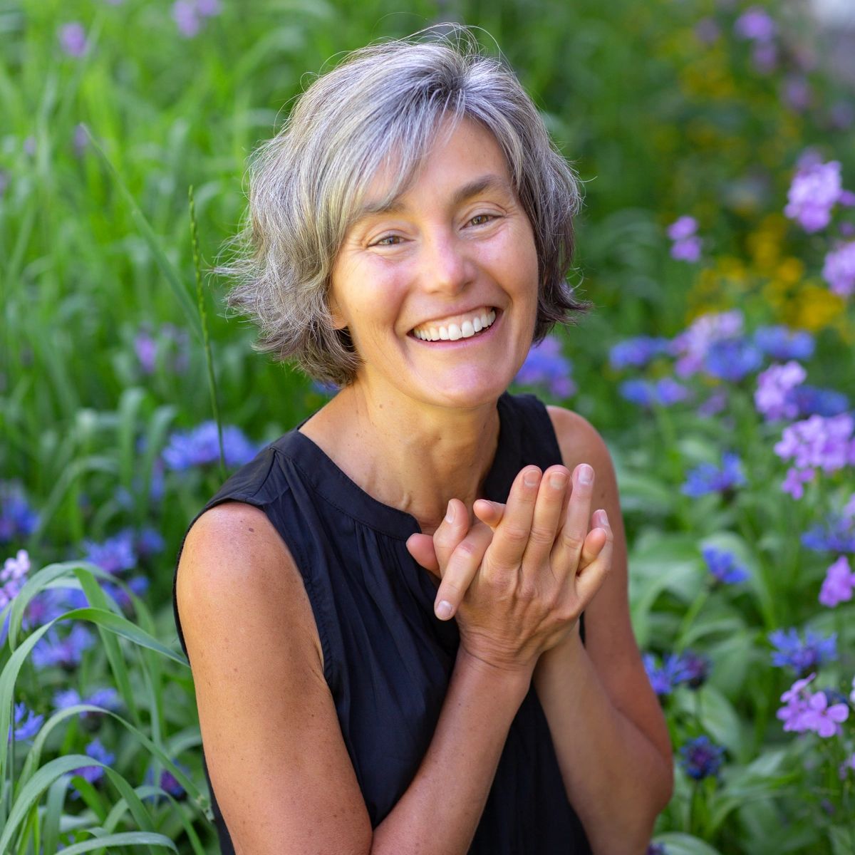 Amy Layne Litzelman, sitting in flowers